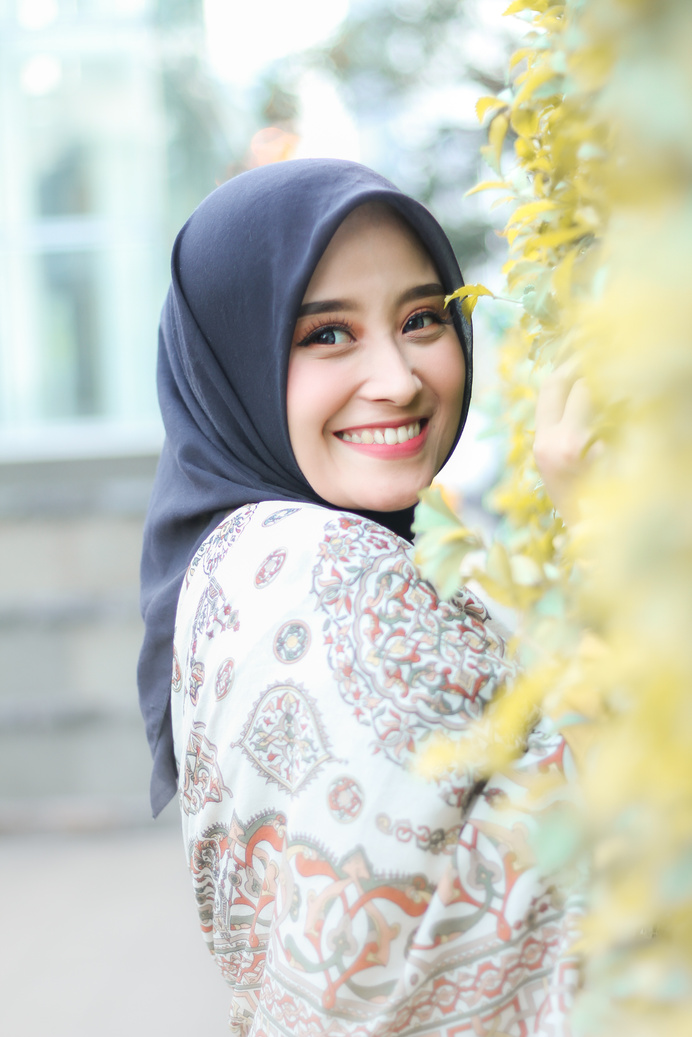 A Smiling Woman on Blue Hijab